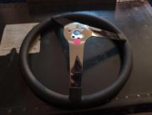 (UPBR1) G.L. 3 STEERING WHEEL. CHROME WITH BLACK PADDING. IT MEASURES 14-1/2" IN DIA.
