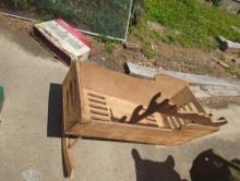 (GAR) LOT OF 2 ITEMS TO INCLUDE, WALL HANGING WOODEN GUN RACK, AND A WOODEN CHILDRENS ROCKER MISSONG