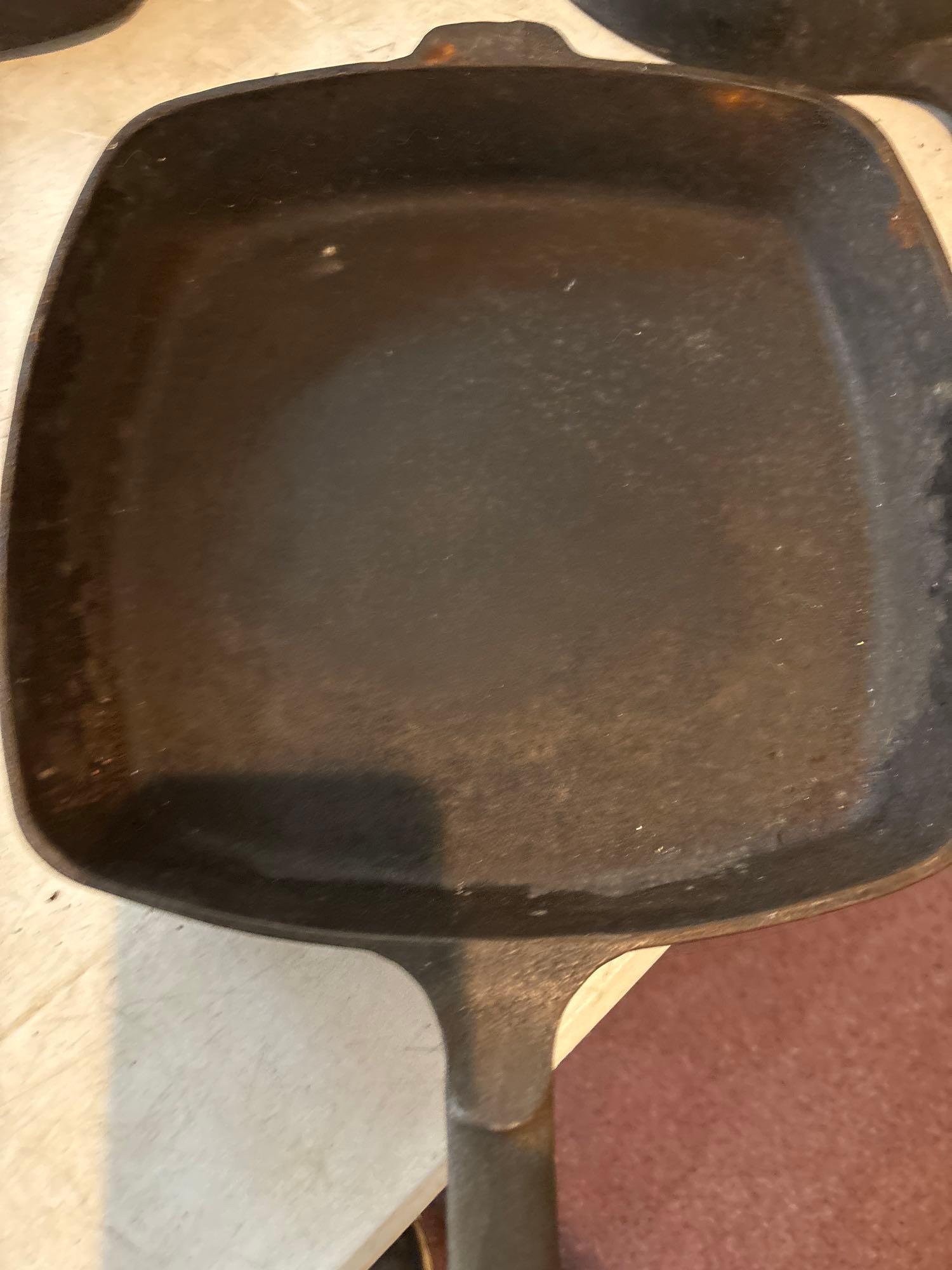 seven cast iron pans