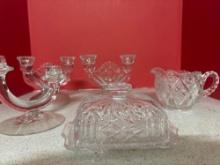Nice collection of glass butter dishes candlesticks creamers sugars Etc.