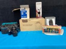 Canon camera, video light, cream dispenser, massager, Simpson items