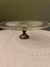 Glass cake stand with weighted sterling base