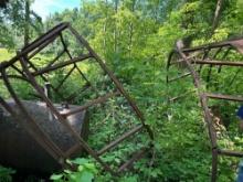 2 old round bale hay feeders rough