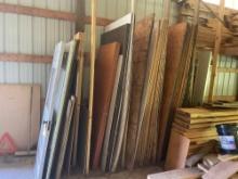 assortment of plywood and man doors