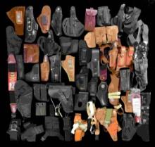 LARGE LOT OF ASSORTED FIREARMS HOLSTERS &