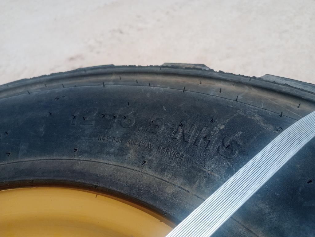 (4) Unused Skid Steer Wheels w/Caterpillar Tires 12-16.5
