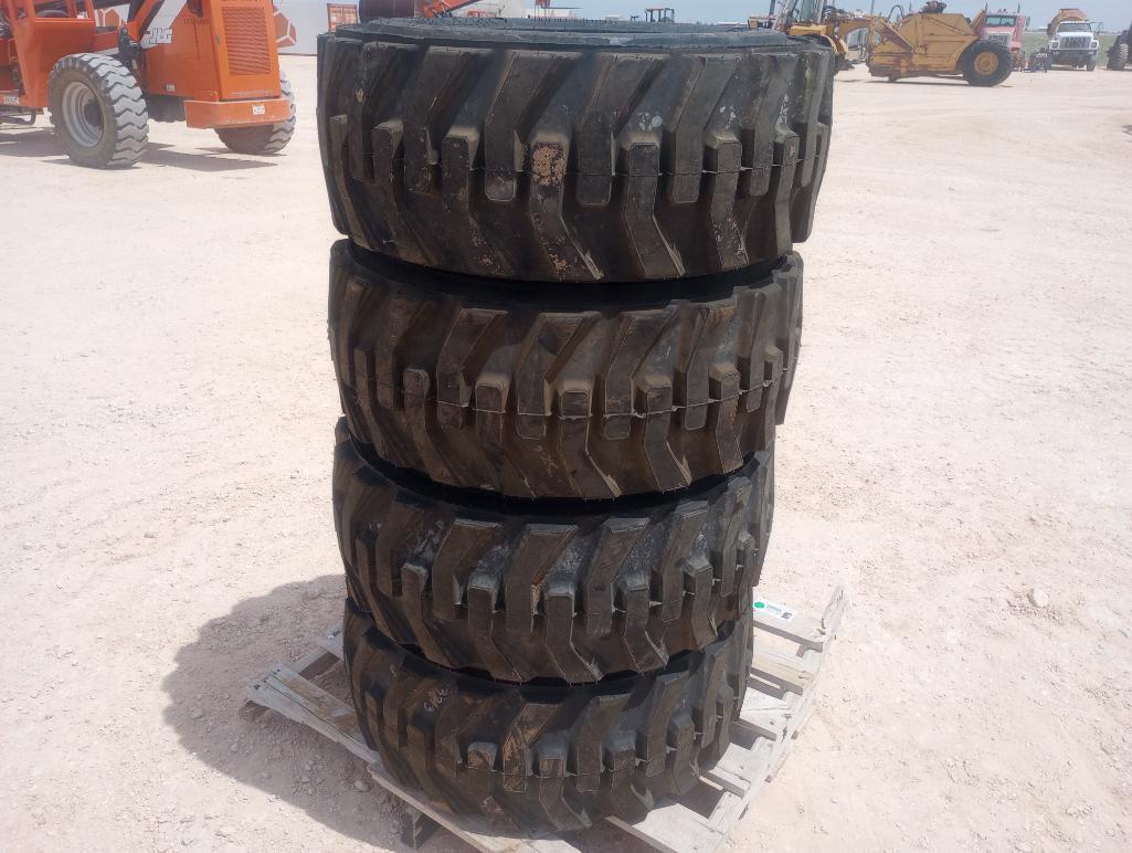 (4) Unused Skid Steer Wheels w/Caterpillar Tires 12-16.5