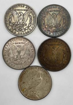 (4) Morgan Silver dollars. 1883, 1889, 1902, 1921, also 1934 Peace Silver Dollar with some glue on