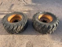 2 USED TIRES W/ RIMS FOR SKID STEER 15-19.5