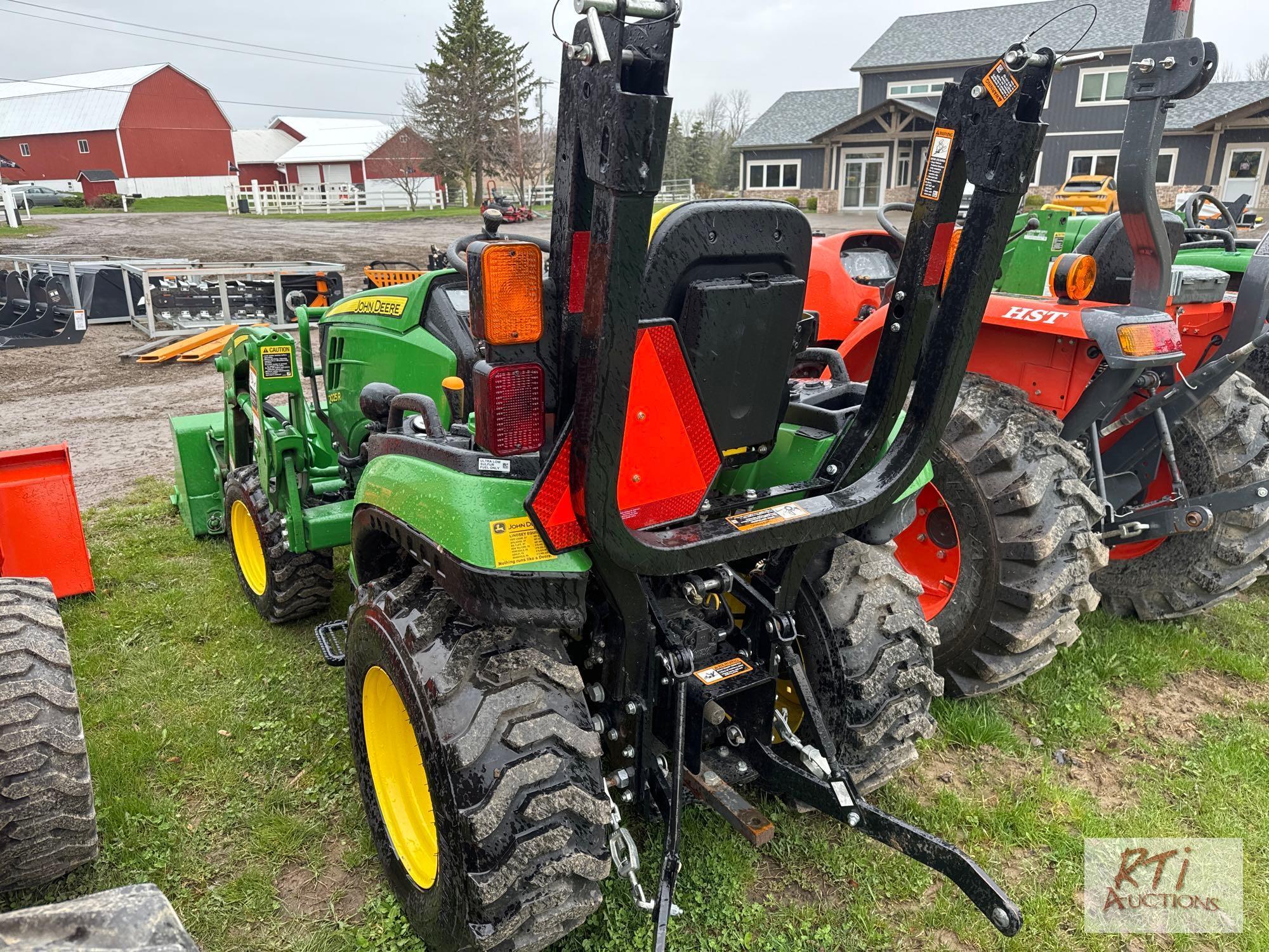 John Deere 2025R 4WD compact diesel tractor, with loader and quick attach bucket, 140hrs. Sells with