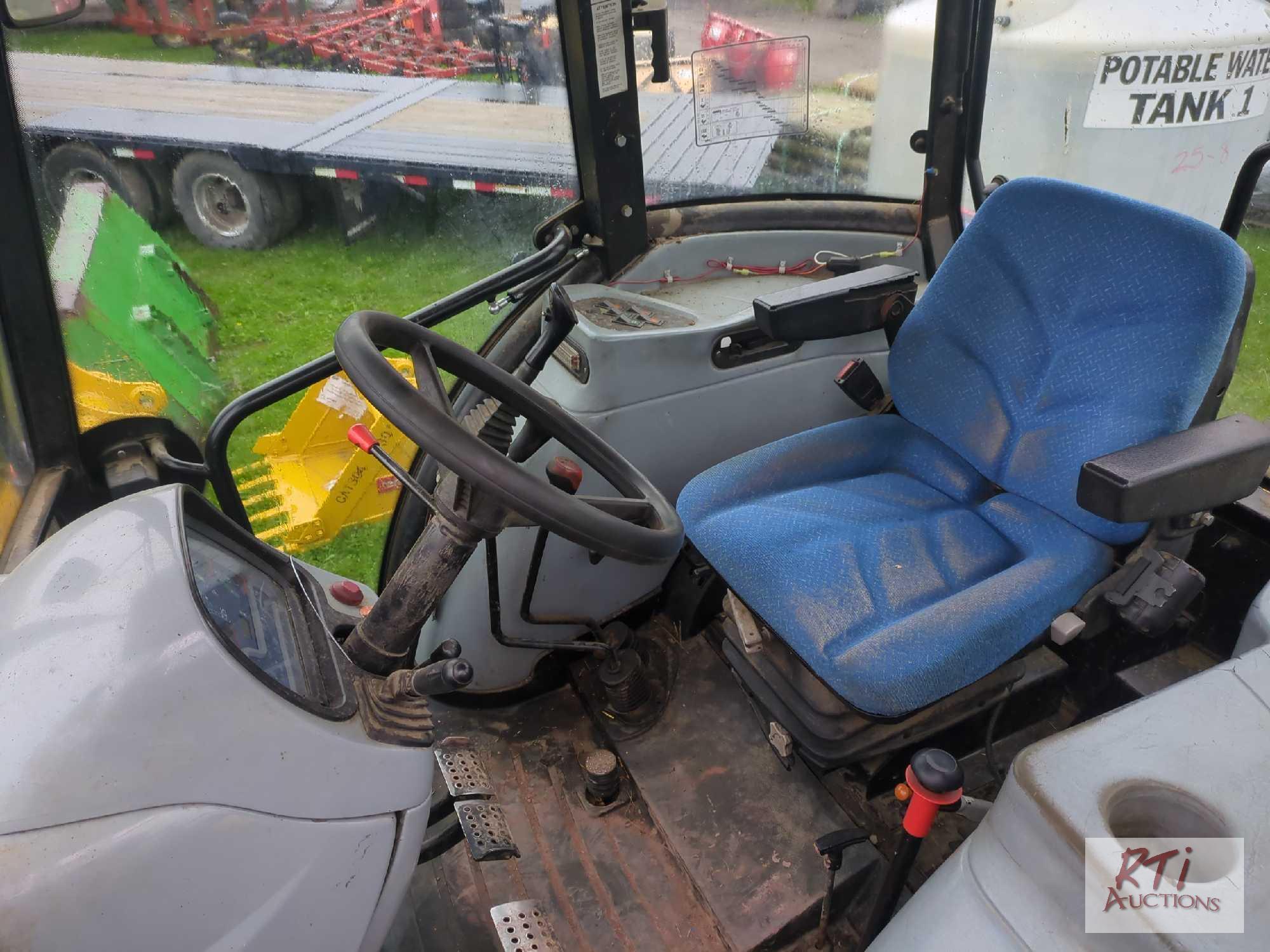 New Holland TD5050 tractor with loader, bucket, cab, lift arms, draw bar, PTO, 2 remotes, 4WD,