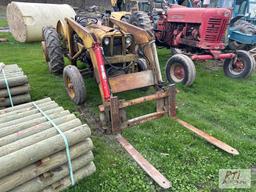 Ford tractor with loader, 48in forks, wheel weights on back, lift arm, PTO, gas, 1708 hrs