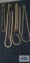 Gold colored costume jewelry necklaces and bracelets