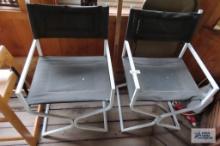 Pair of faux leather chairs with metal frames