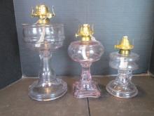 Three Old Purplish Clear Glass Post Oil Lamps