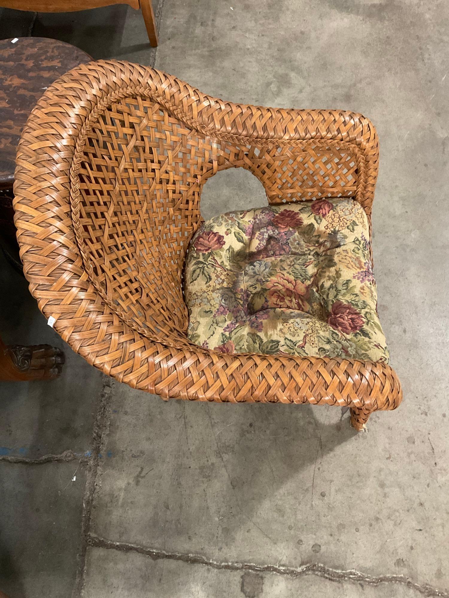Vintage Woven Rattan Trellis Back Patio Armchair w/ Floral Cushion. Measures 31" x 36" See pics.