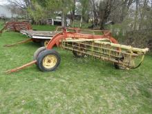 147. NEW HOLLAND 256 9 FT. PARALLEL BAR RAKE WITH HITCH WHEEL