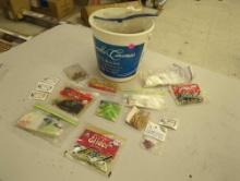 Bucket of fishing lures, fishing hooks, and other fishing accessories. Comes as is shown in photos.