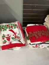 miscellaneous vintage printed Christmas tablecloth and napkins