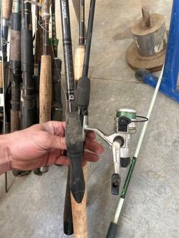 assorted fishing rods - wood stand - anchor - roller stand