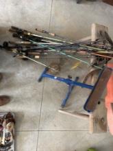 assorted fishing rods - wood stand - anchor - roller stand