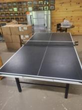 Stigna regulation size portable ping pong table.